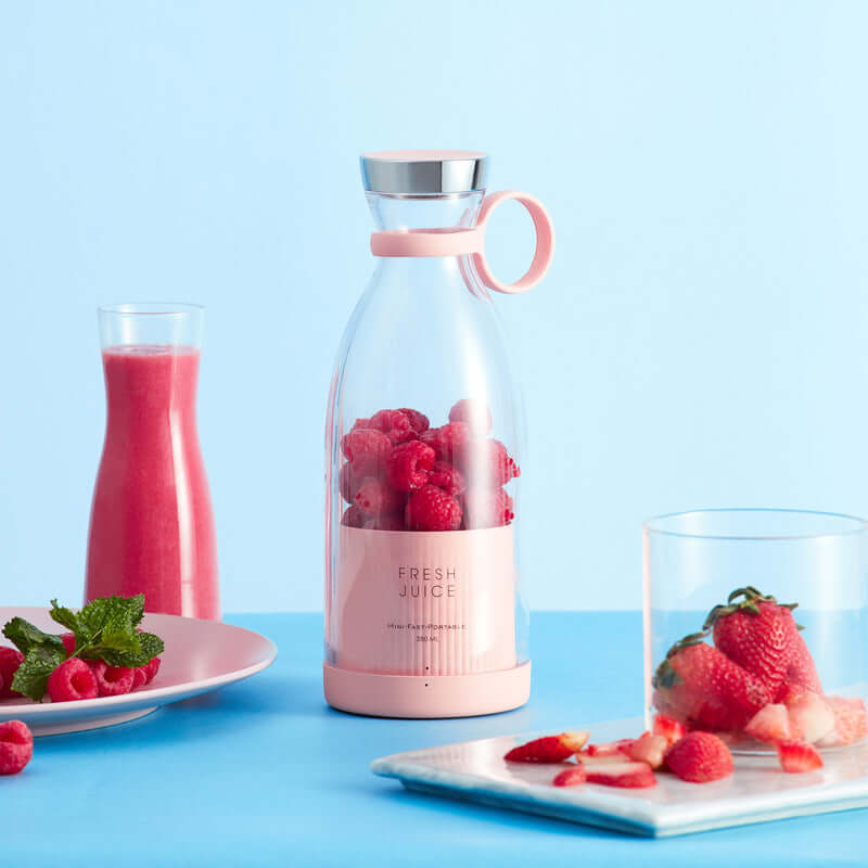 Portable electric blender, fruit juicer, and mixer for on-the-go smoothies, designed to effortlessly blend fruits and liquids into a smooth, nutritious drink anytime, anywhere.