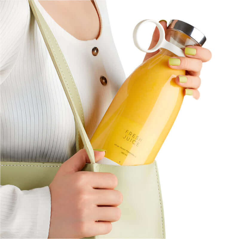 Portable electric blender, fruit juicer, and mixer for on-the-go smoothies, designed to effortlessly blend fruits and liquids into a smooth, nutritious drink anytime, anywhere.